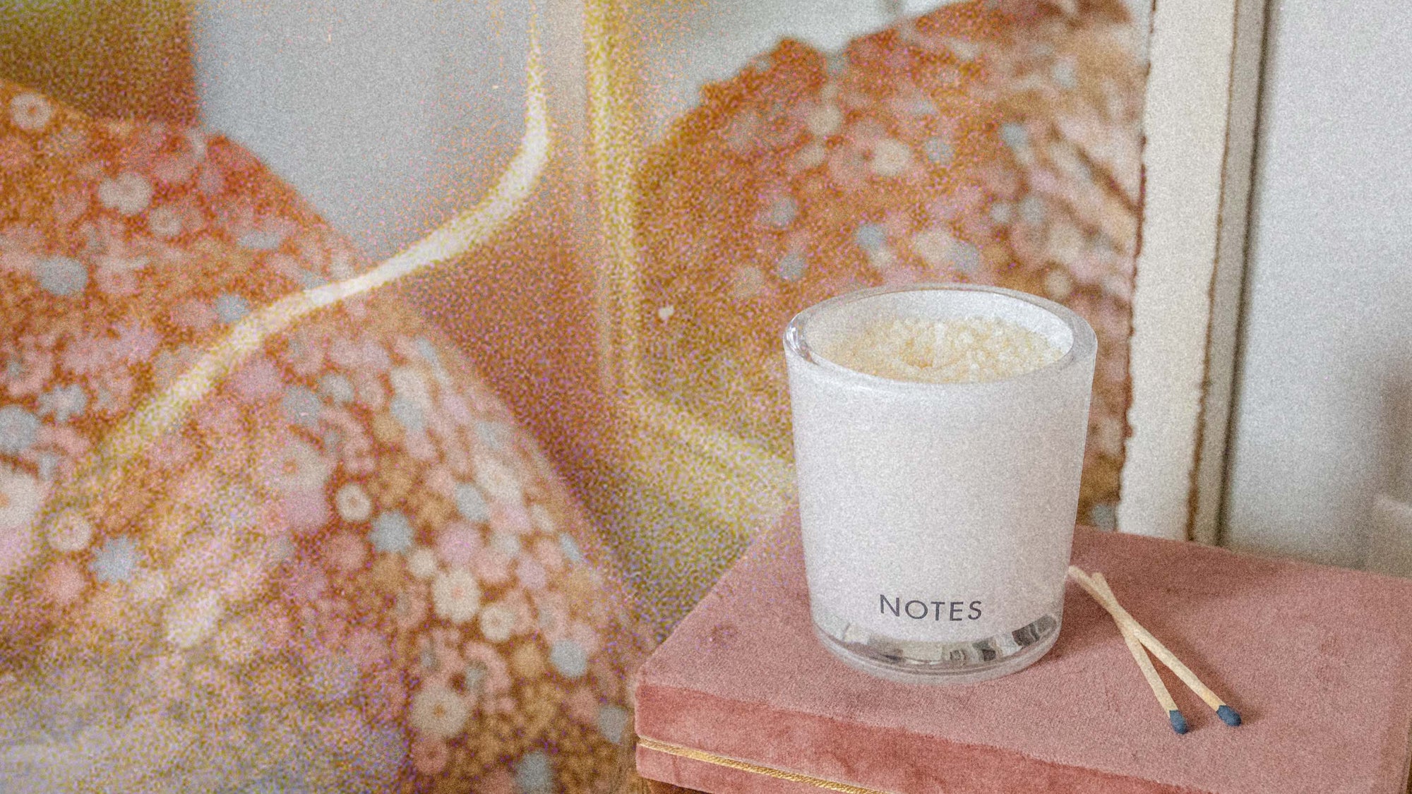 White candle and matches decorating a room